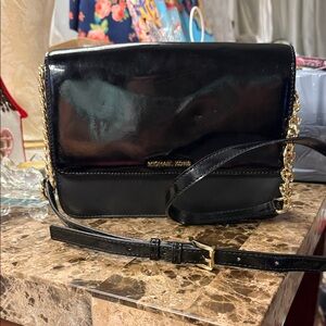 Michael Kors Glossy Black Crossbody Bag with Gold Accents